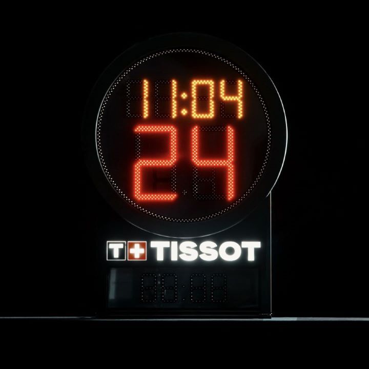 The new Tissot Shot Clock with the time illuminated in red and orange