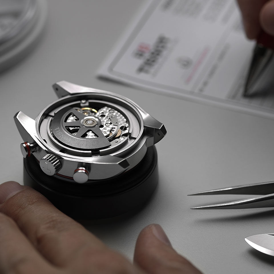 Automatic watch being serviced by a watchmaker